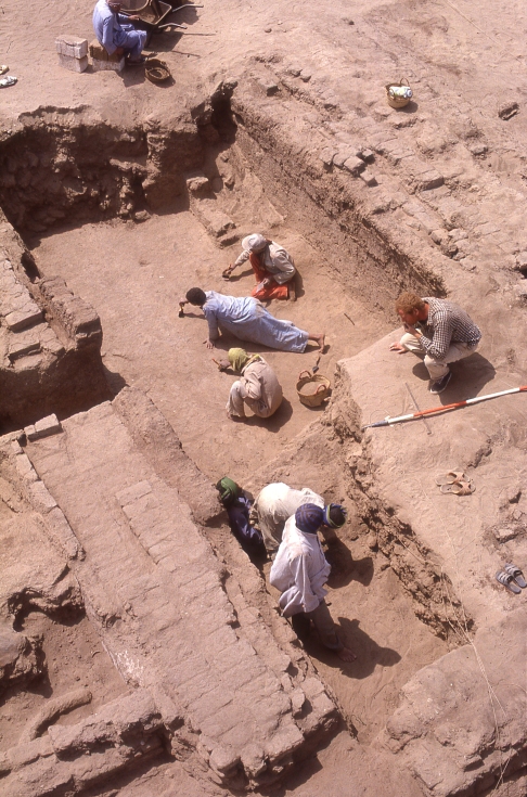 Part of the monastic complex: The monks cleared out some of the Amarna-period rooms and rebuilt them to provide the various elements of a monastery, here perhaps a refectory, its floor at a lower level than that of the surrounding ground. Archaeologist Duncan Schlee supervises a stage in the excavation.